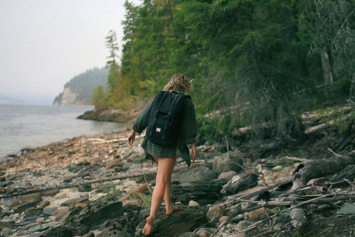 Traveler walking along the coast